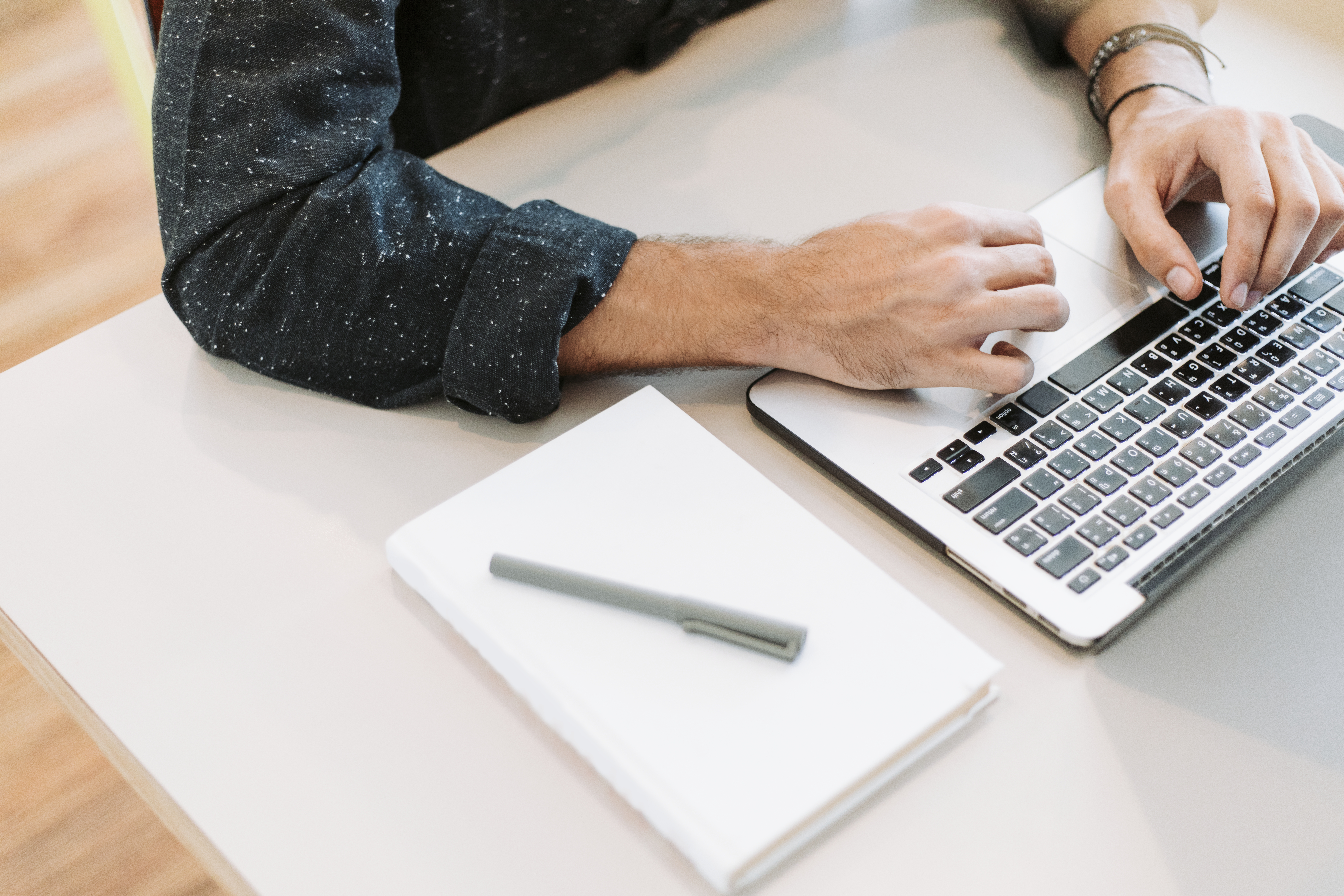 Photo of man typing on a laptop - Derick Lefleur outsourcing conslutant